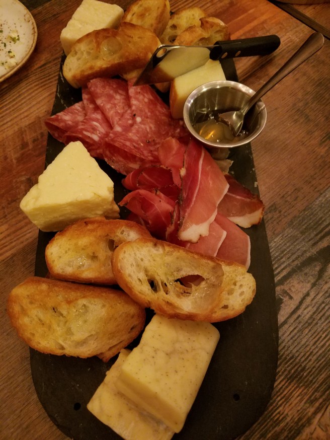 Selection of 4 cheeses (Scamorza, Truffle Cheddar, Parmigiano-Reggiano and Cabot Clothbound Cheddar) and 2 meats (Speck and Hot Sopressata)