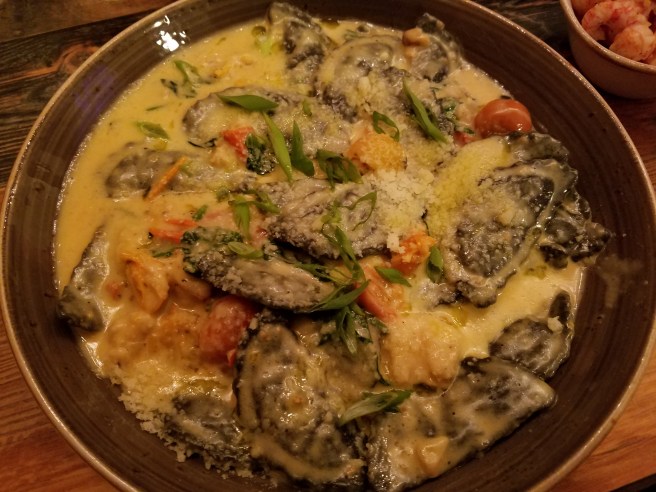 Lobster Agnolotti, spinach, tomatoes, in a cheddar truffle cream sauce